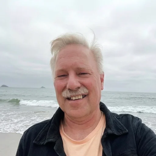 Albie smiling on the beach at Oxnard